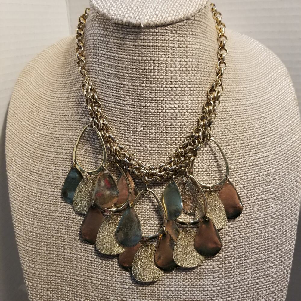 Bib style necklace gold tone sixteen inch with a three extension